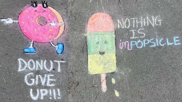 Chalk drawings of a donut and a popsicle the former says "donut give up!!!" the latter "Nothing is impopsicle"